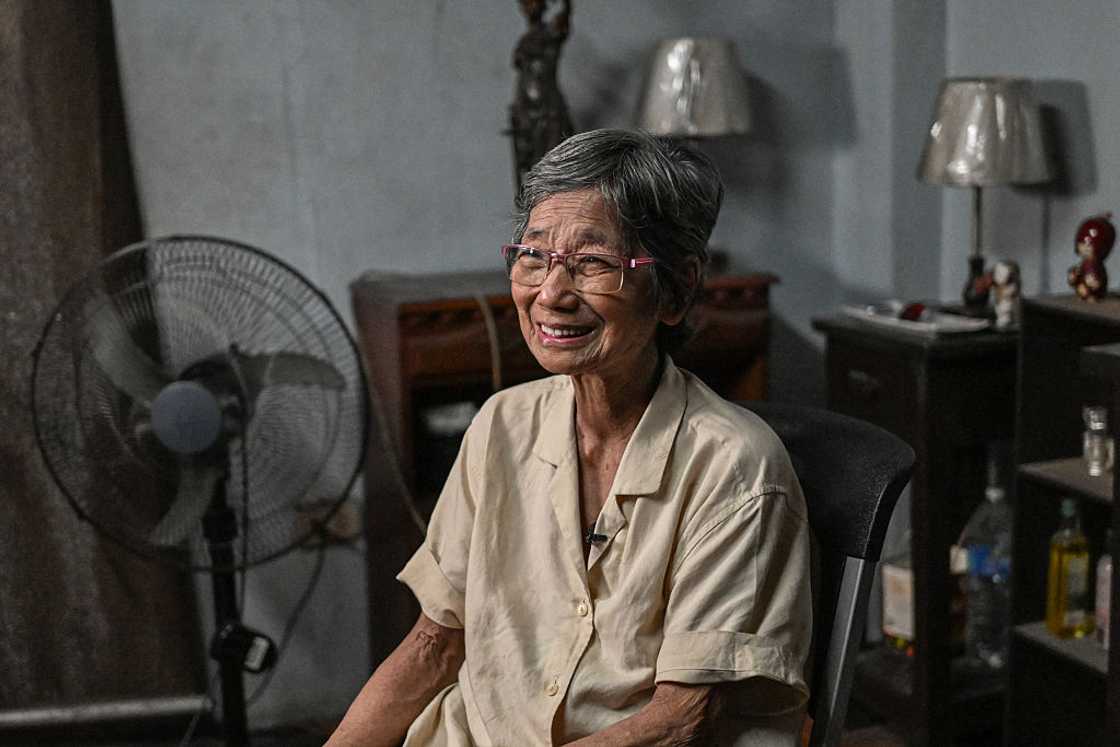 An old woman sitting in church An old woman sitting in church