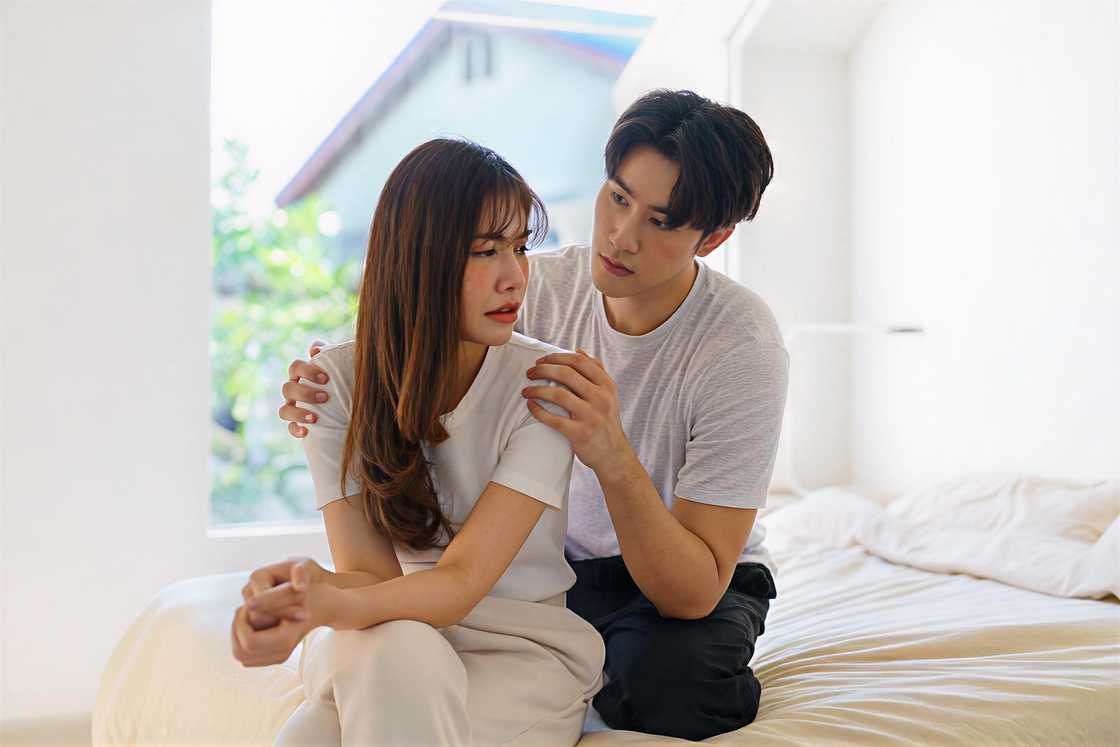 An Asian man is with his girlfriend