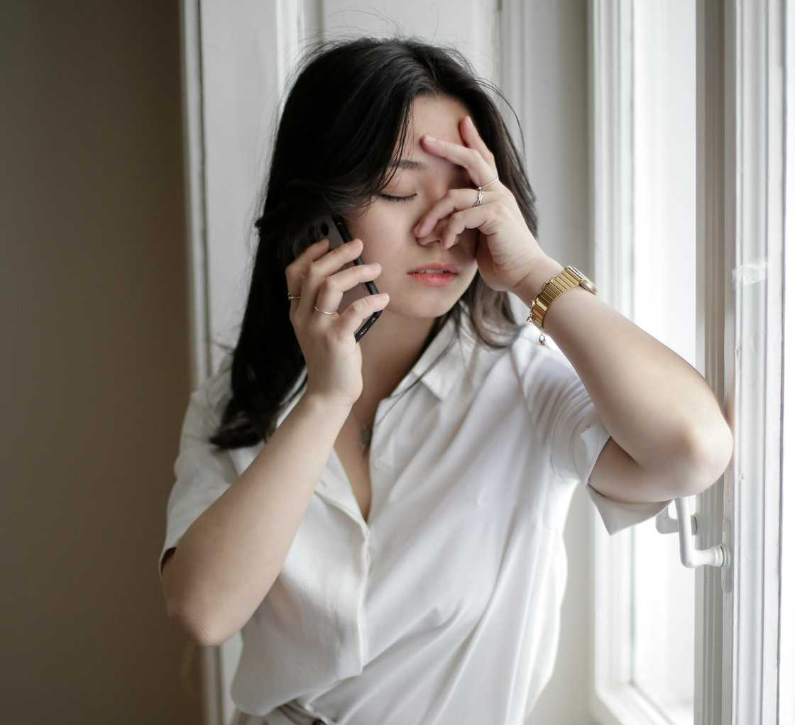 A worried woman on a call