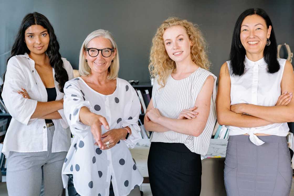 A team of businesswomen smiling.