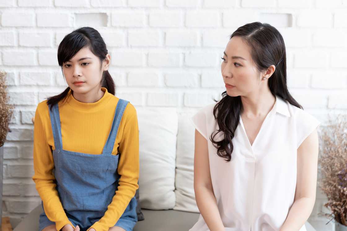 A desperate child talking to her mother A desperate child talking to her mother