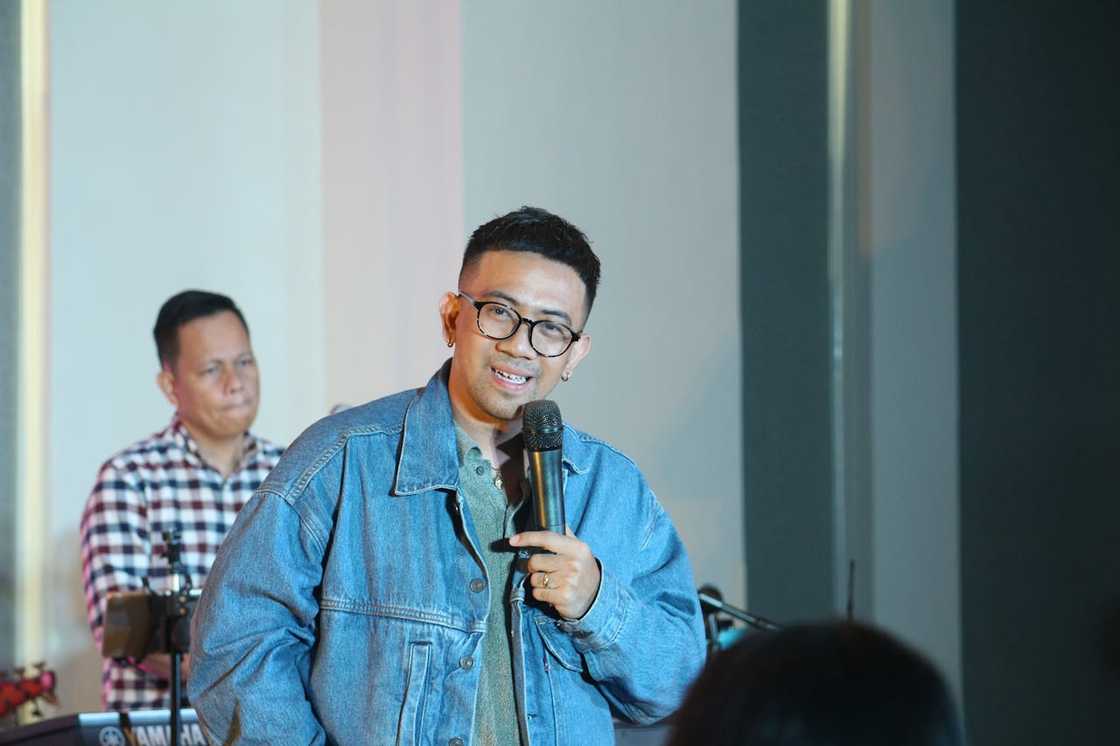 A young man speaking passionately on the pulpit.