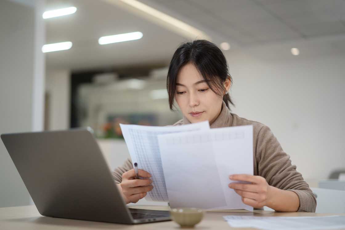 A lady goin through her reports