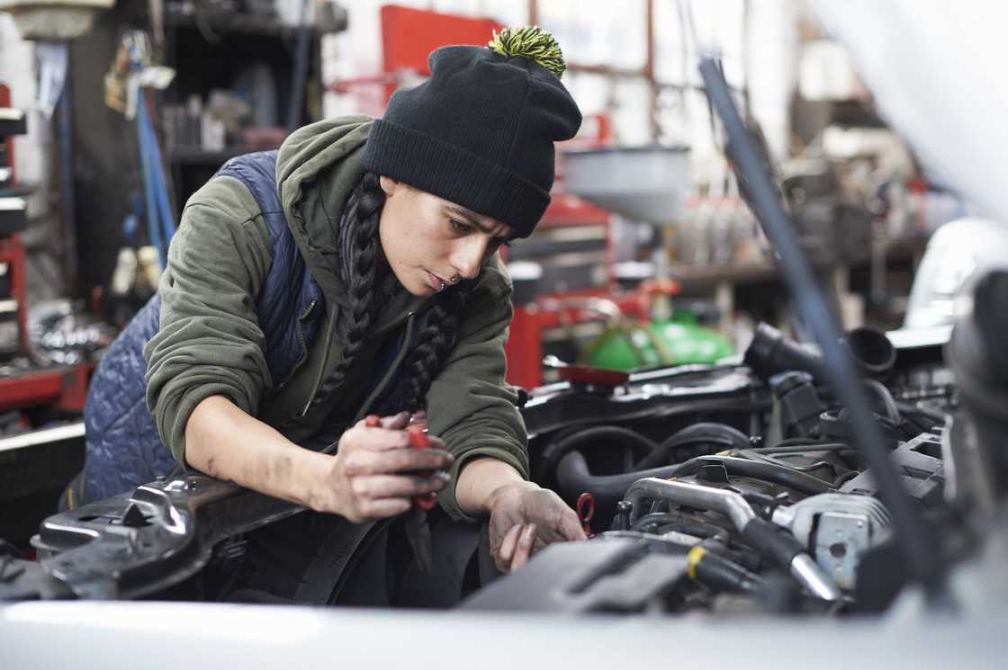 A female car mechanic A female car mechanic