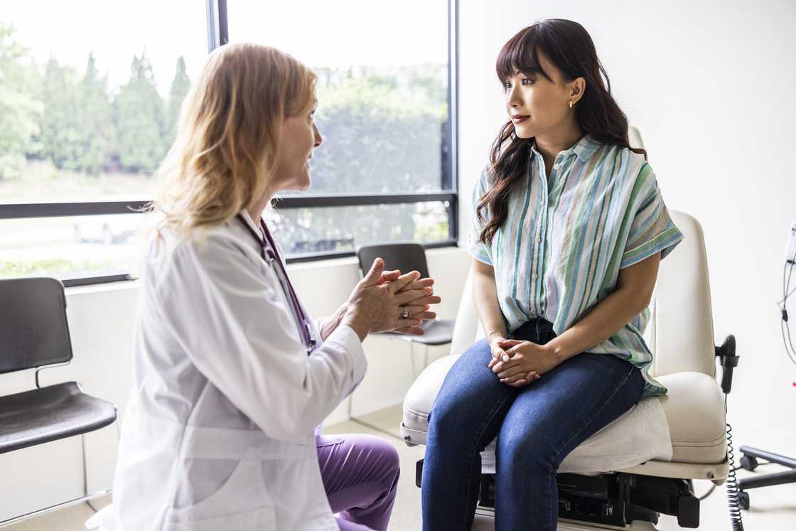 A mother talks to a doctor