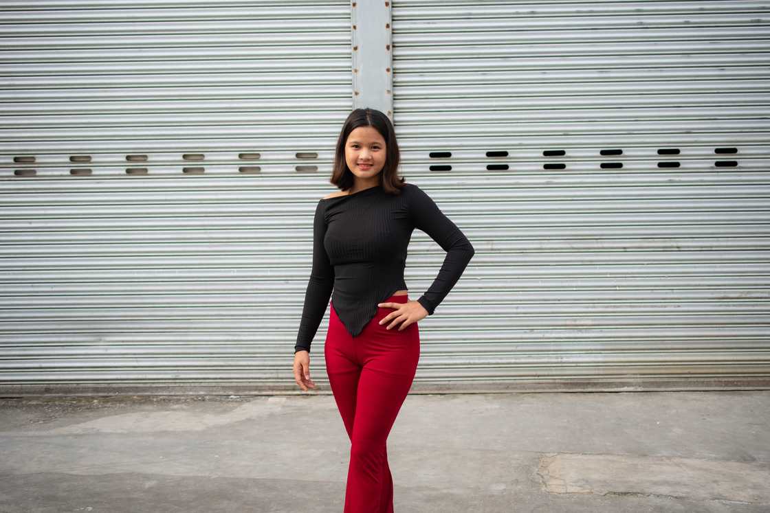 A confident woman pis possing for a photo. A confident woman pis possing for a photo.