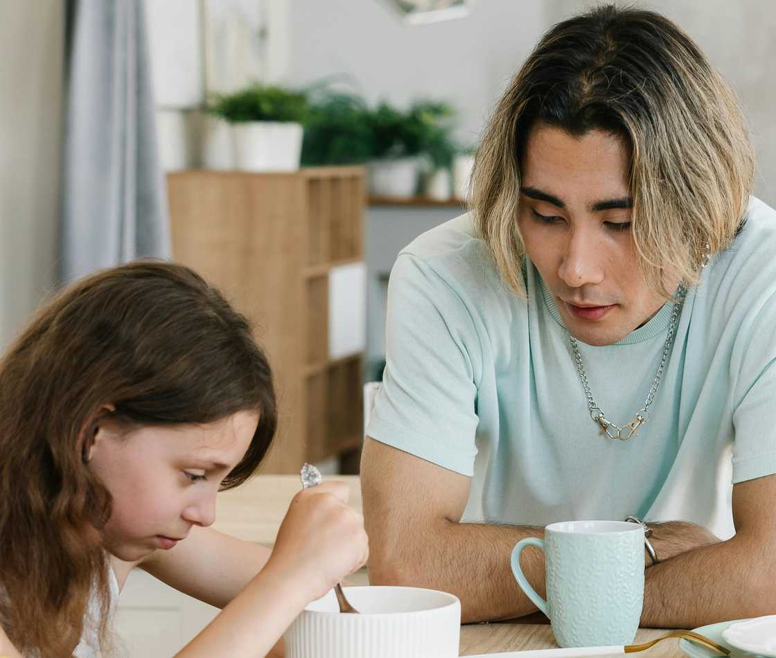 A father talking to his daughter