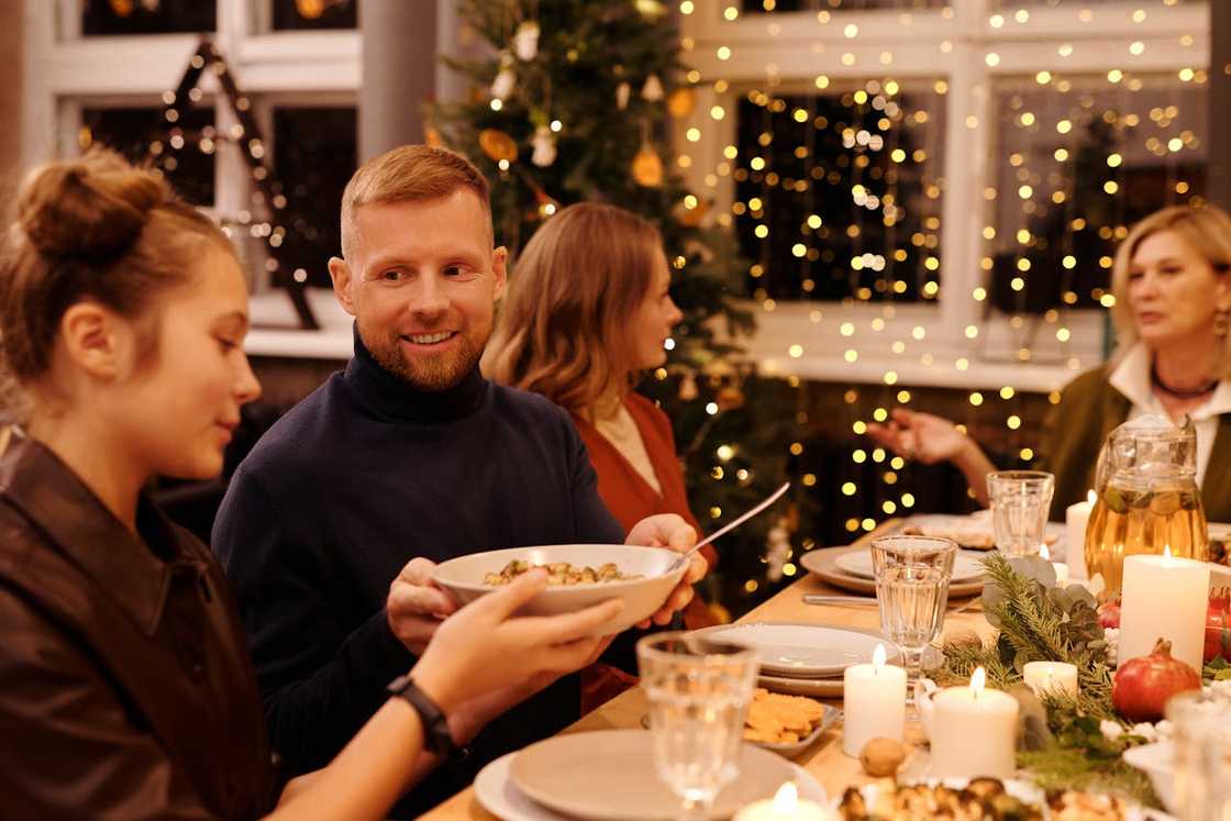 A family celebrating during a dinner party.