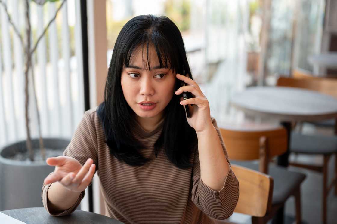 A serious woman on a call