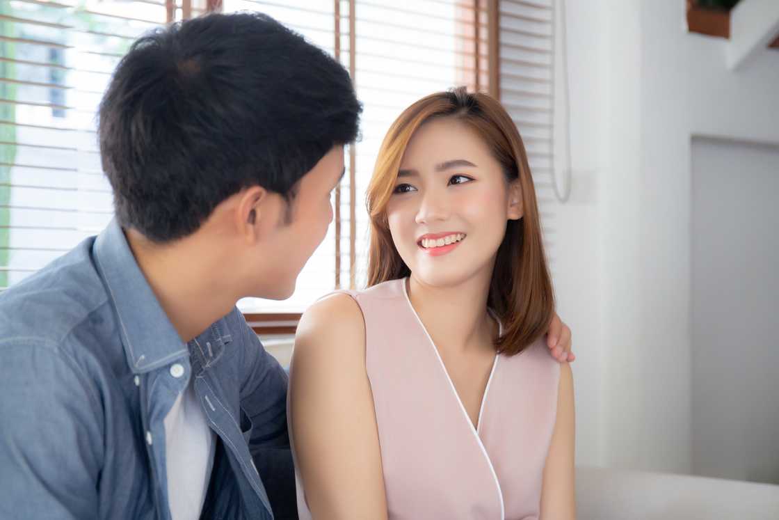 A couple relax and talking in the living room A couple relax and talking in the living room