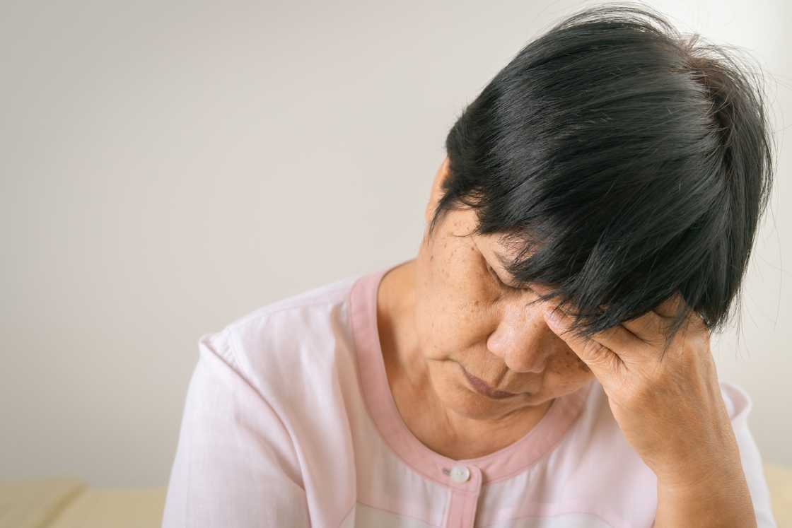 Worried elderly woman