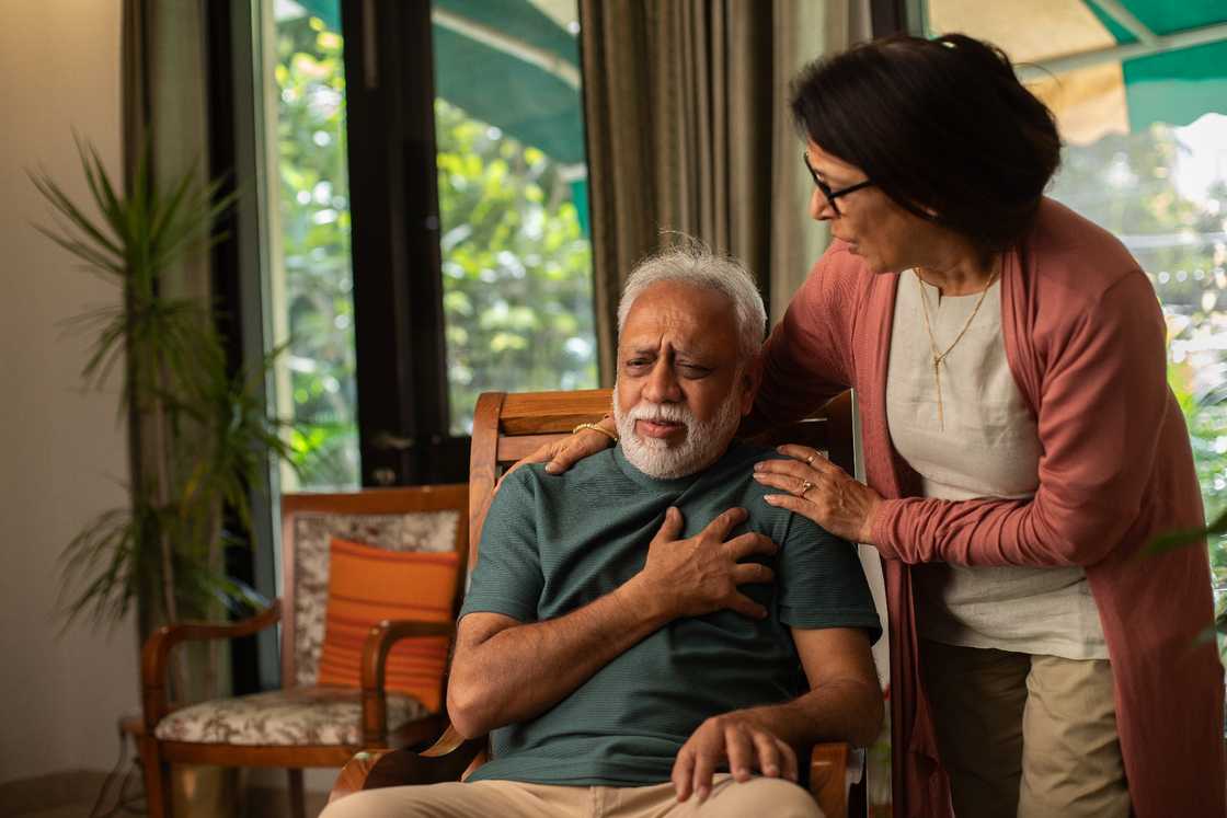 Worried senior wife comforting to old husband Worried senior wife comforting to old husband