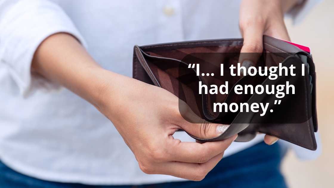 A woman opening an empty wallet A woman opening an empty wallet