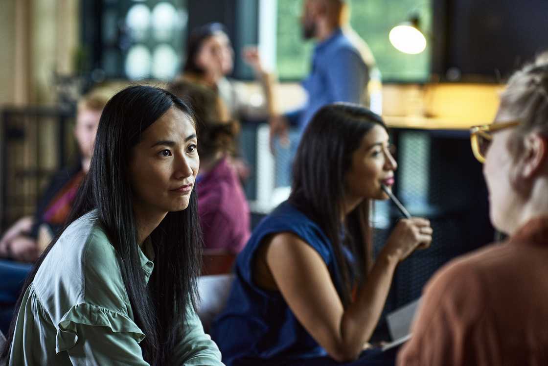 A lady talks to a group of women