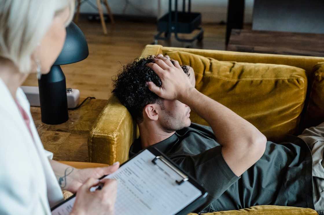 A man talks to his therapist during a counselling session. A man talks to his therapist during a counselling session.
