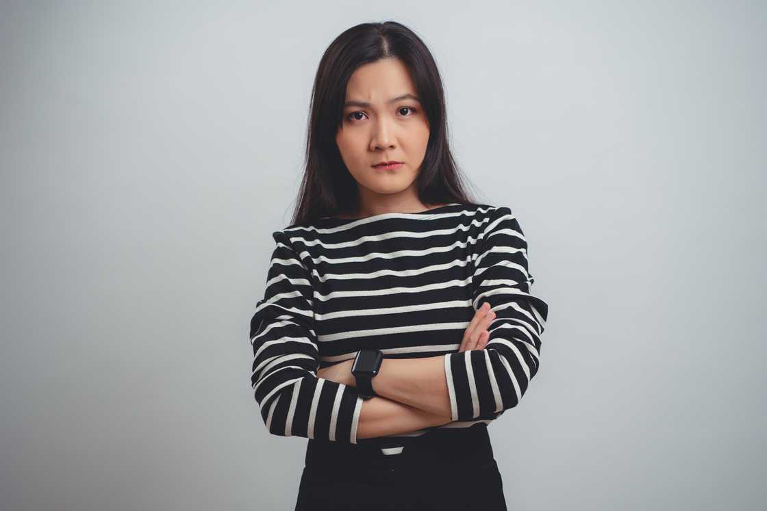 Angry woman with arms closed