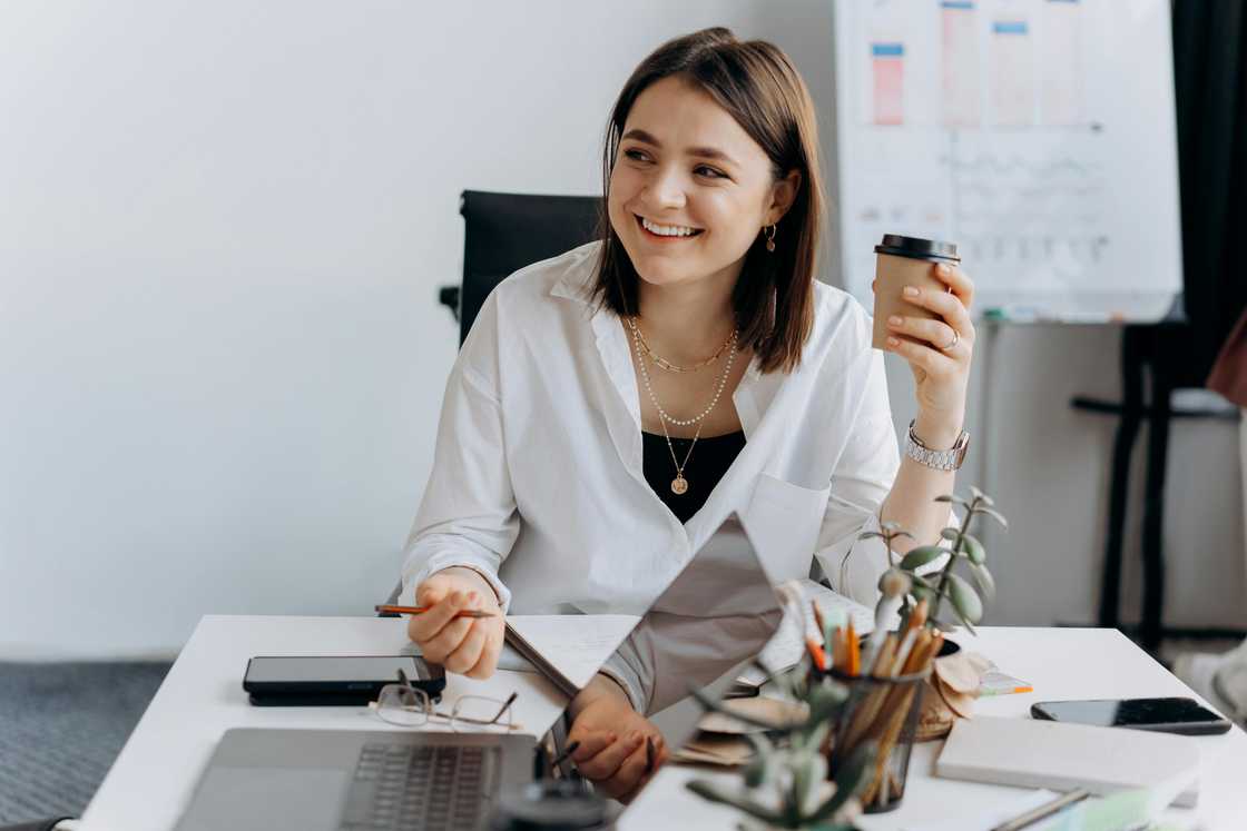 Attentive woman listening to her colleague in the office