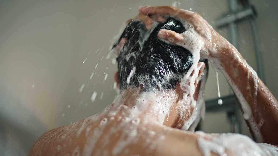 A man is taking a shower A man is taking a shower