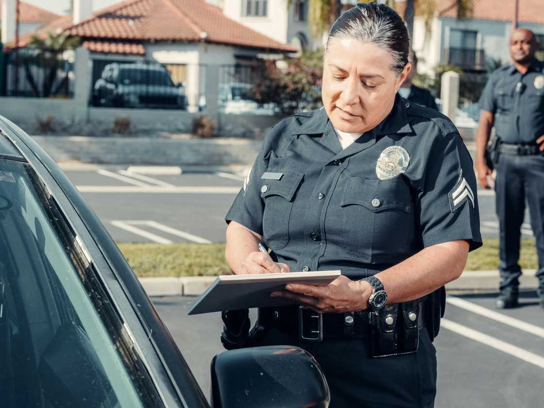 An officer discusses the traffic laws that the driver has violated