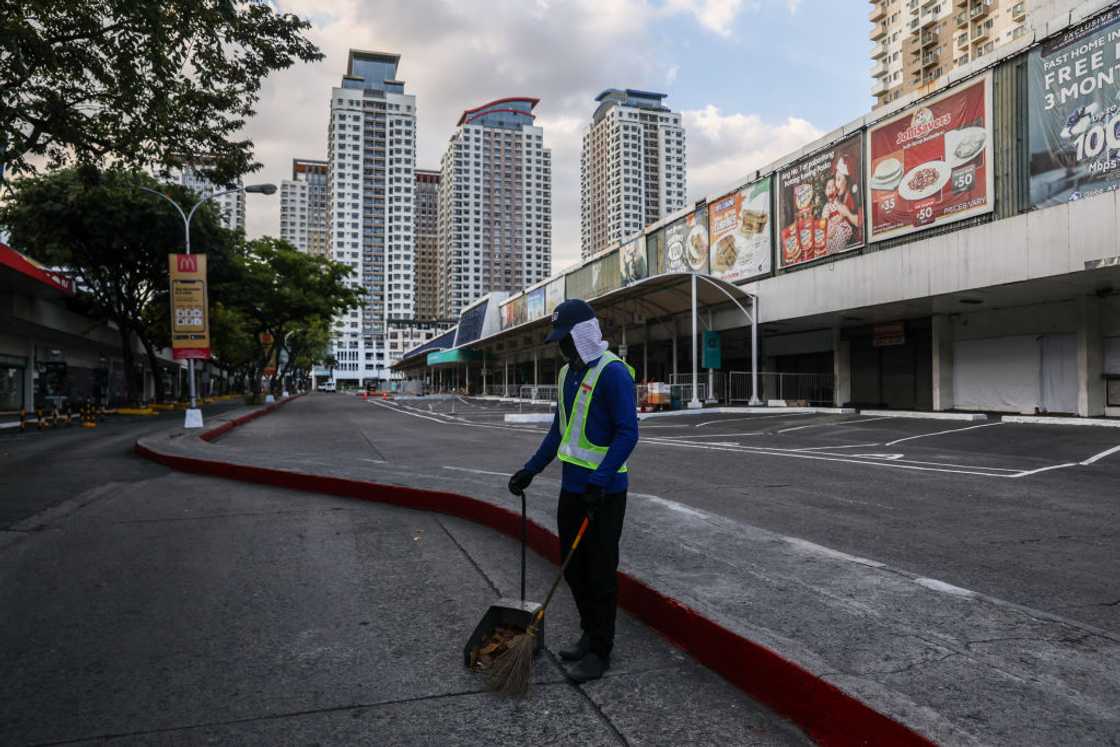 Janitor man working outdoor in Manila
