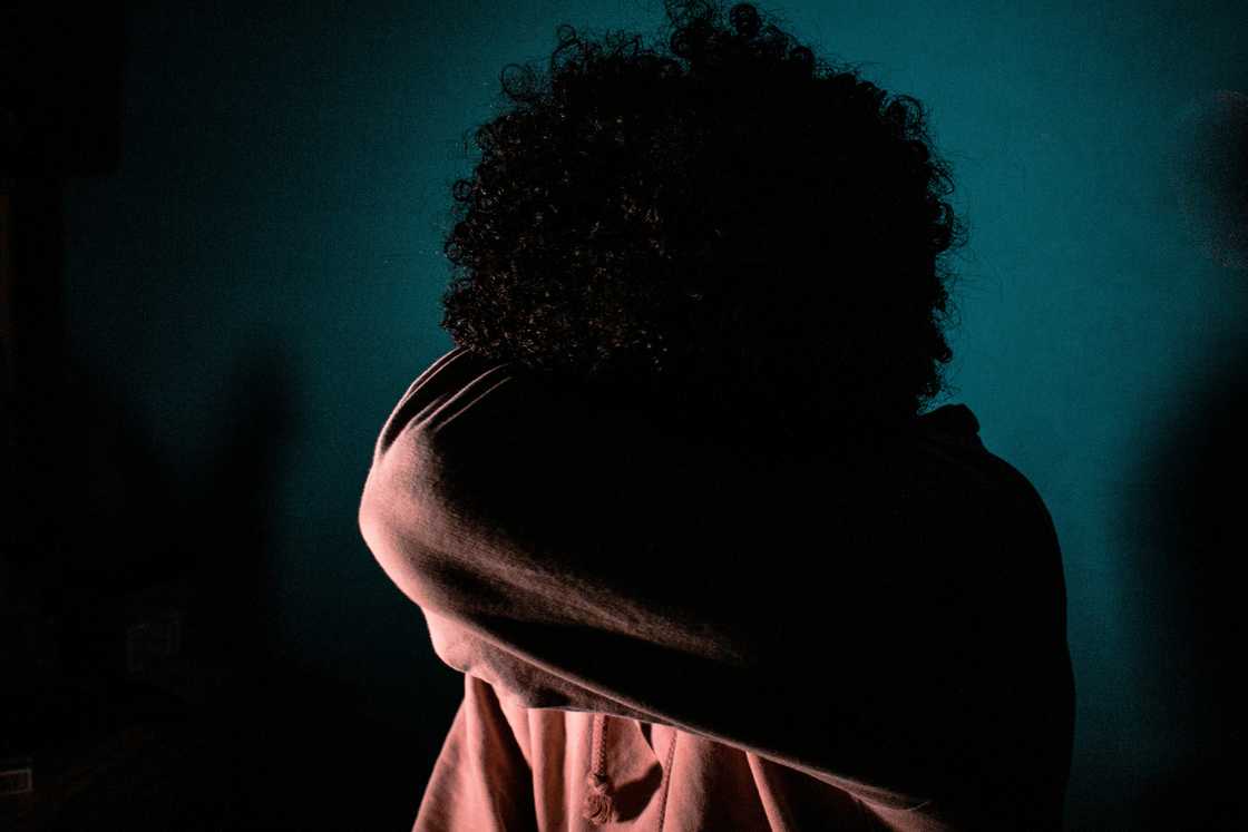 A stressed girl in a dark room