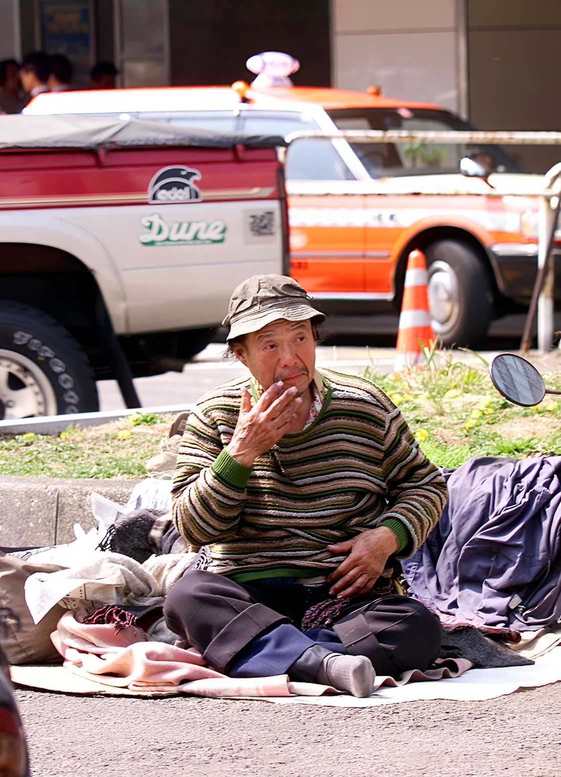 Homeless Asian man outside