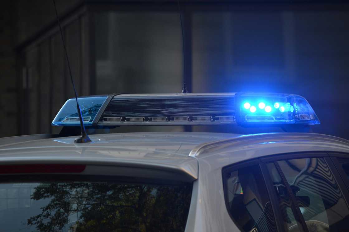 An emergency vehicle with blue light turned on