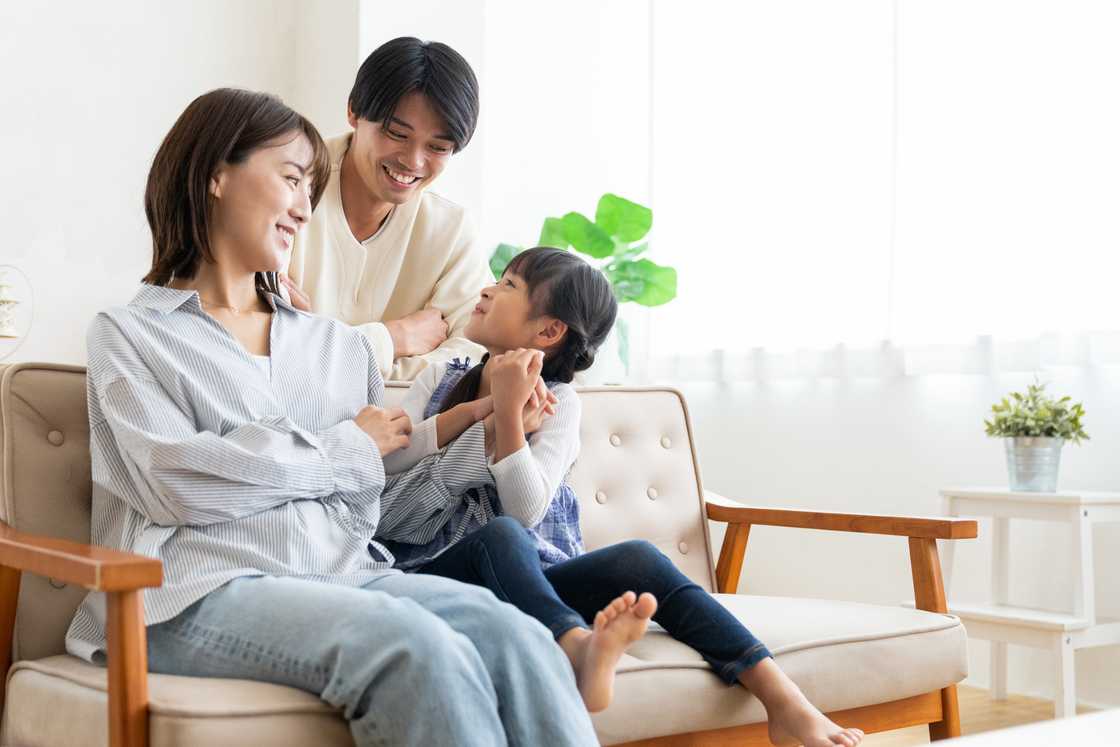 A happy couple and their daughter A happy couple and their daughter