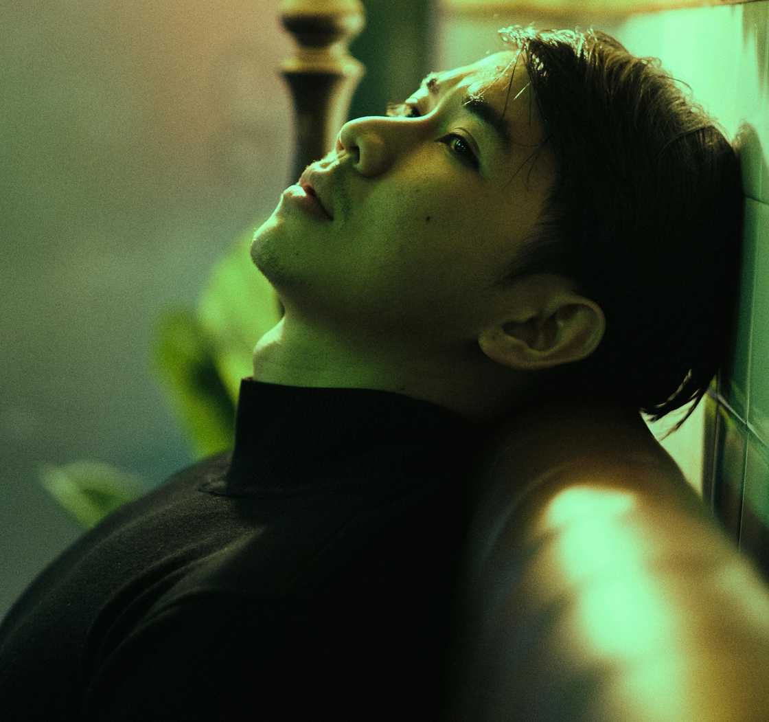 A thoughtful man sitting on a sofa