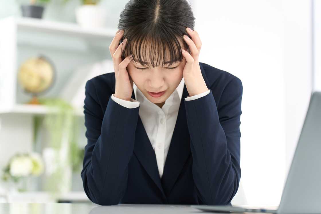 A distressed woman in an office A distressed woman in an office