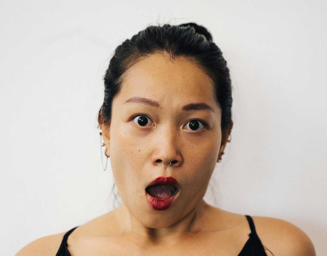 A woman with a shocked face.