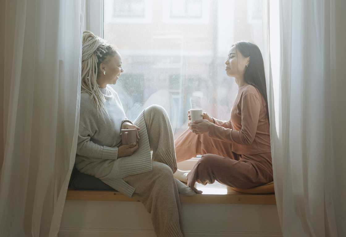 Two women talking indoors