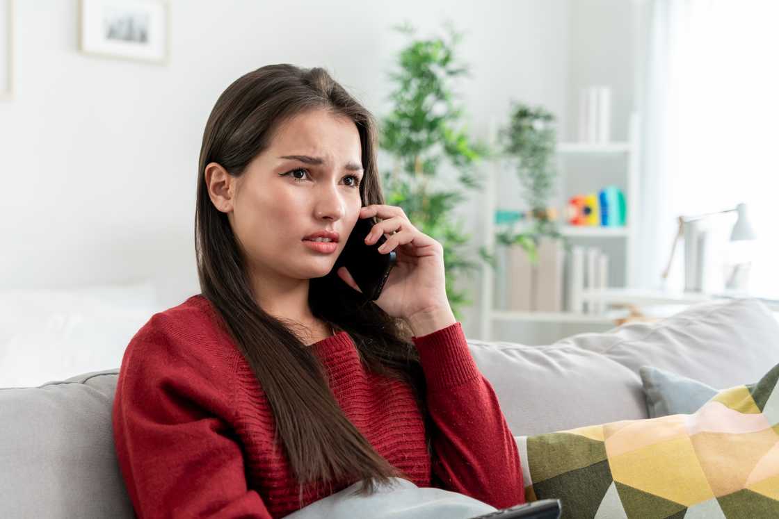 A sad woman on a call