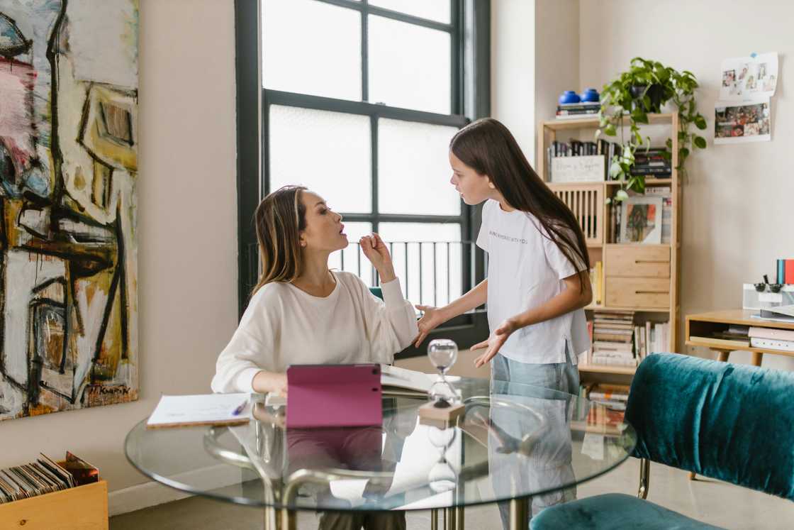 A daughter and mother arguing indoors