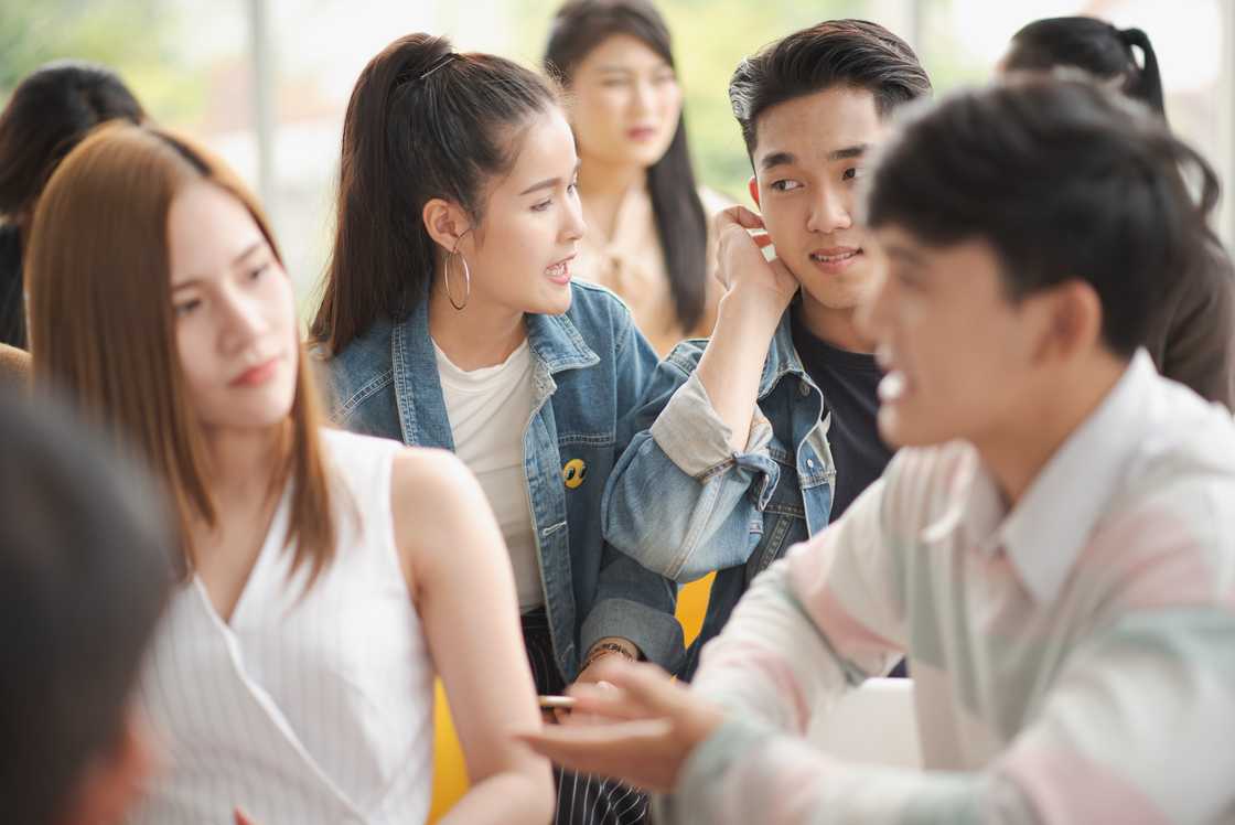 Young Asian people discussing in seminar meeting