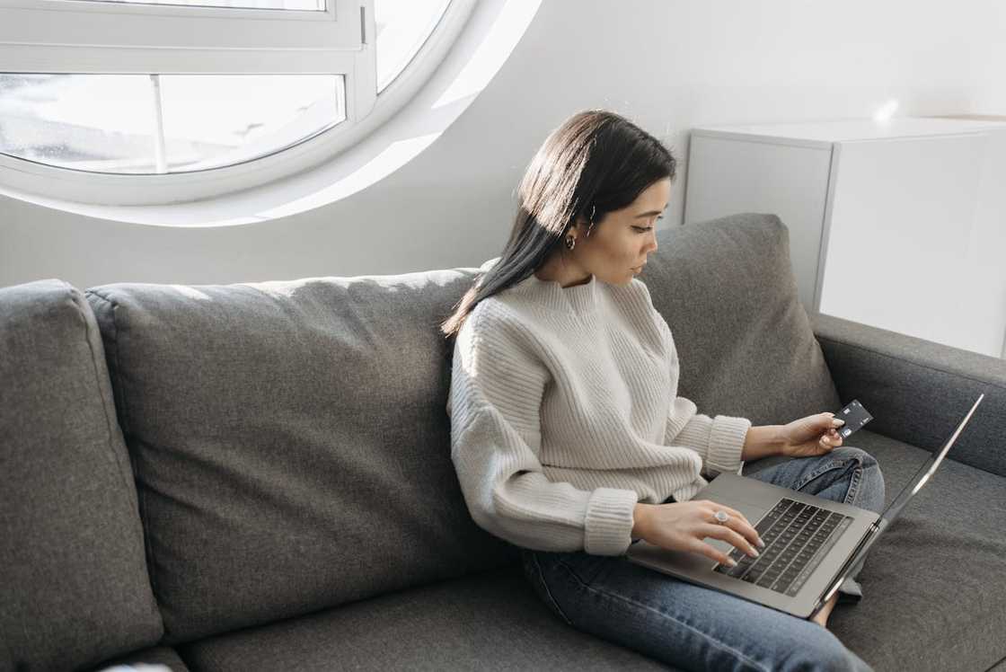 Woman at laptop moderating an online workshop. Woman at laptop moderating an online workshop.