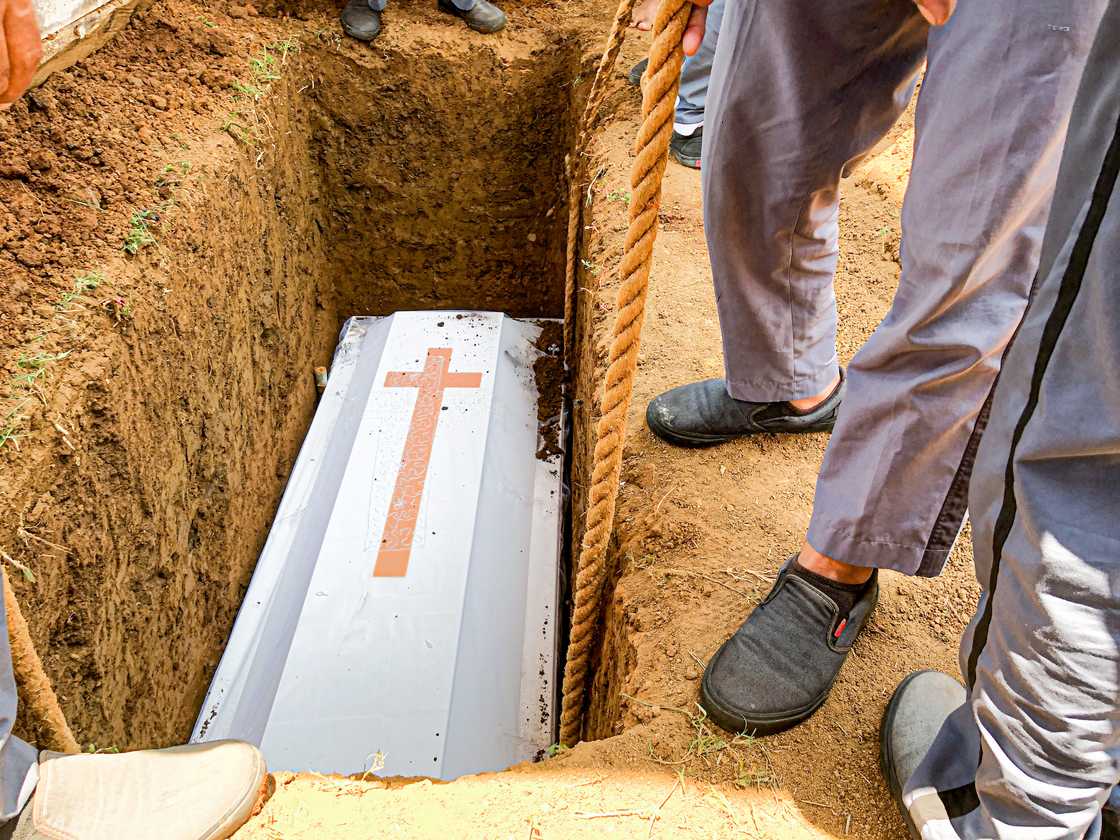 A coffin during a burial A coffin during a burial