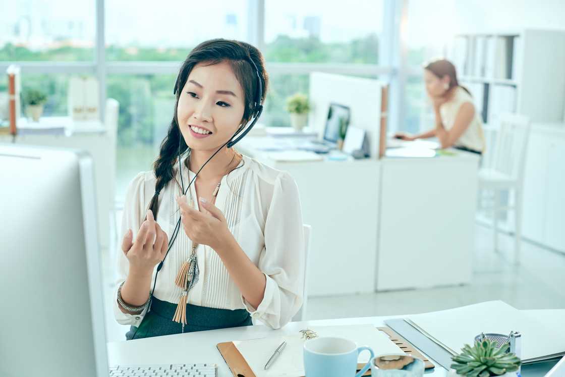 A woman records a call-centre greeting in her natural accent.