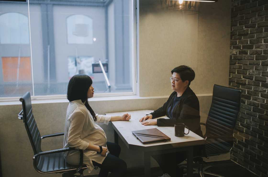 A pregnant lady and her boss