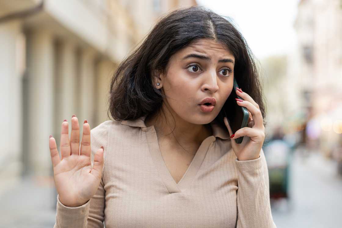A furious lady talks on the phone
