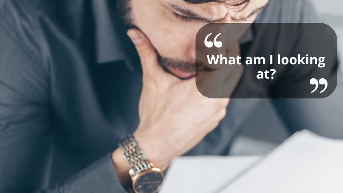 A shocked man reading a document