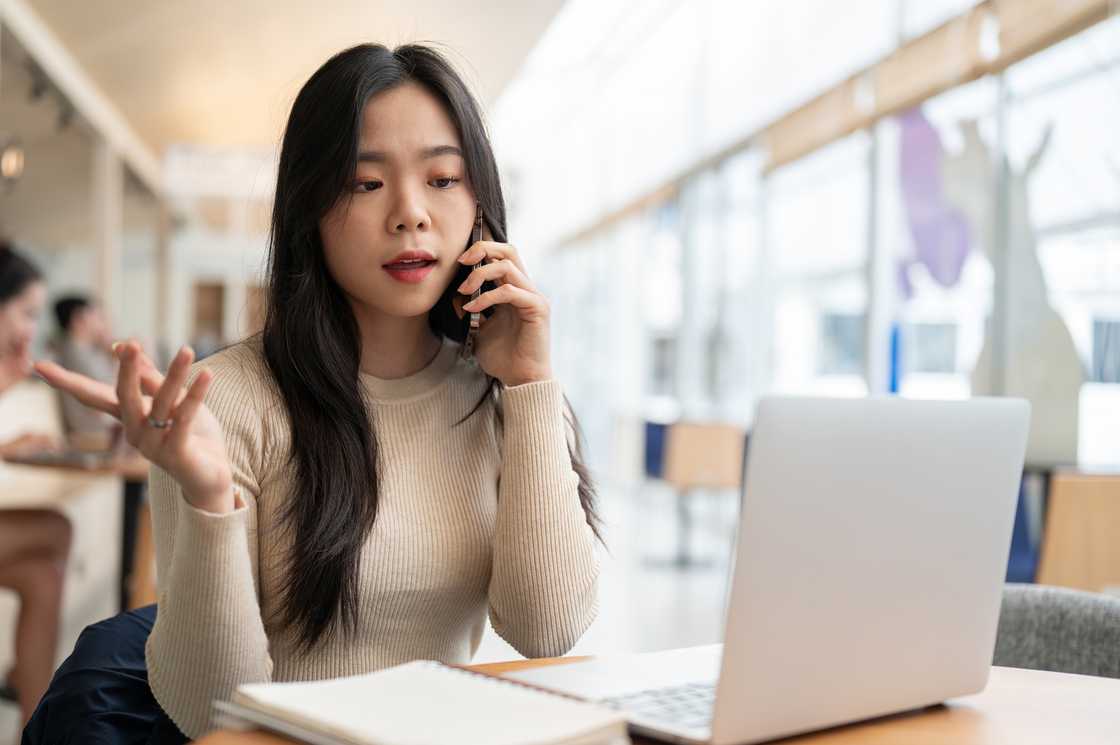A lady is talking on a phone