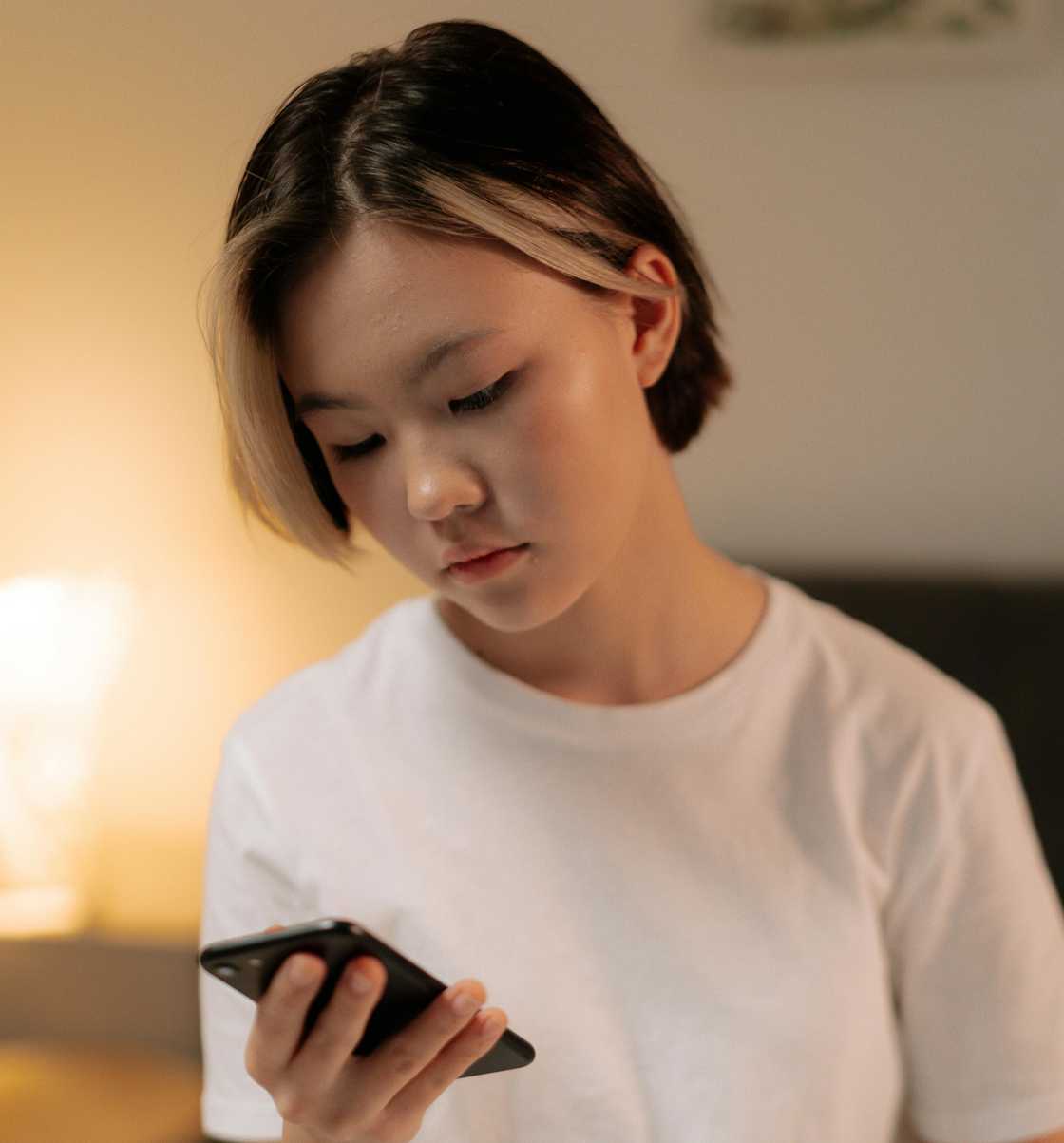 A woman scrolling a phone