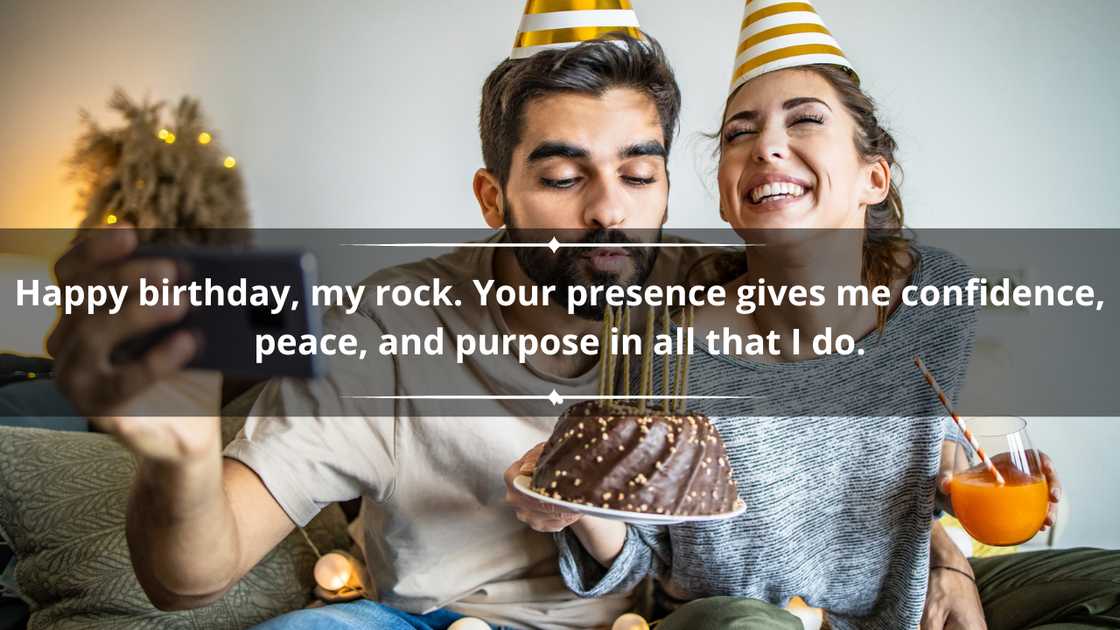 A man and a woman are celebrating a birthday at home