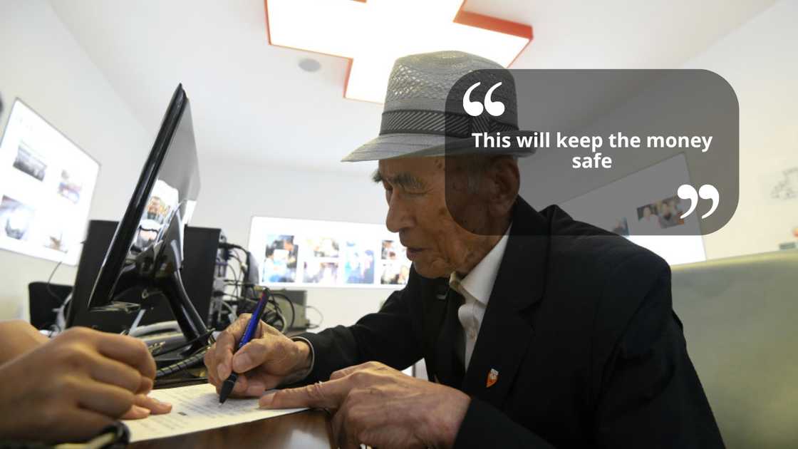 A man signing documents