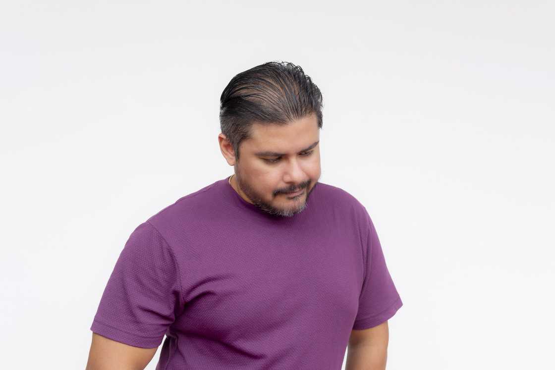 A man in purple tee A man in purple tee