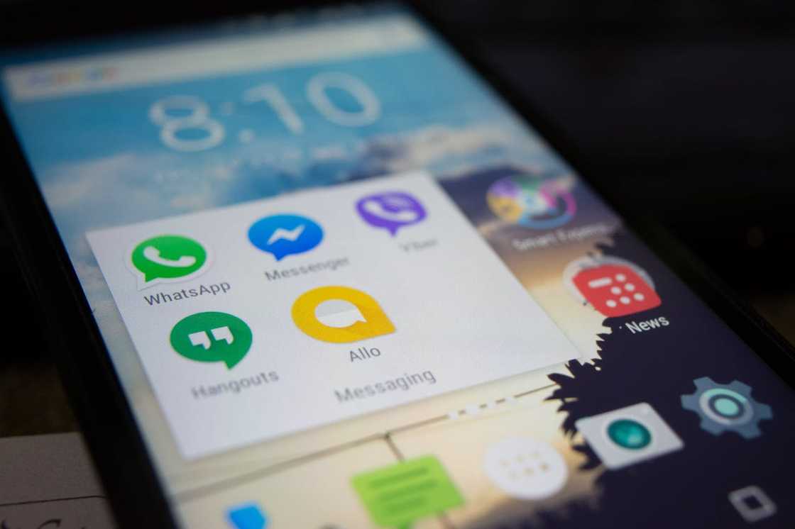 Messaging apps appear on a smartphone screen.