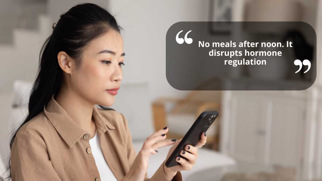 Serious young woman scrolling her smartphone at home Serious young woman scrolling her smartphone at home