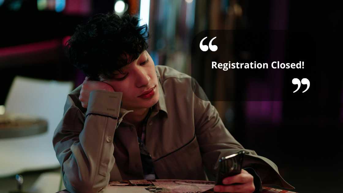 A worried student looking at his phone A worried student looking at his phone