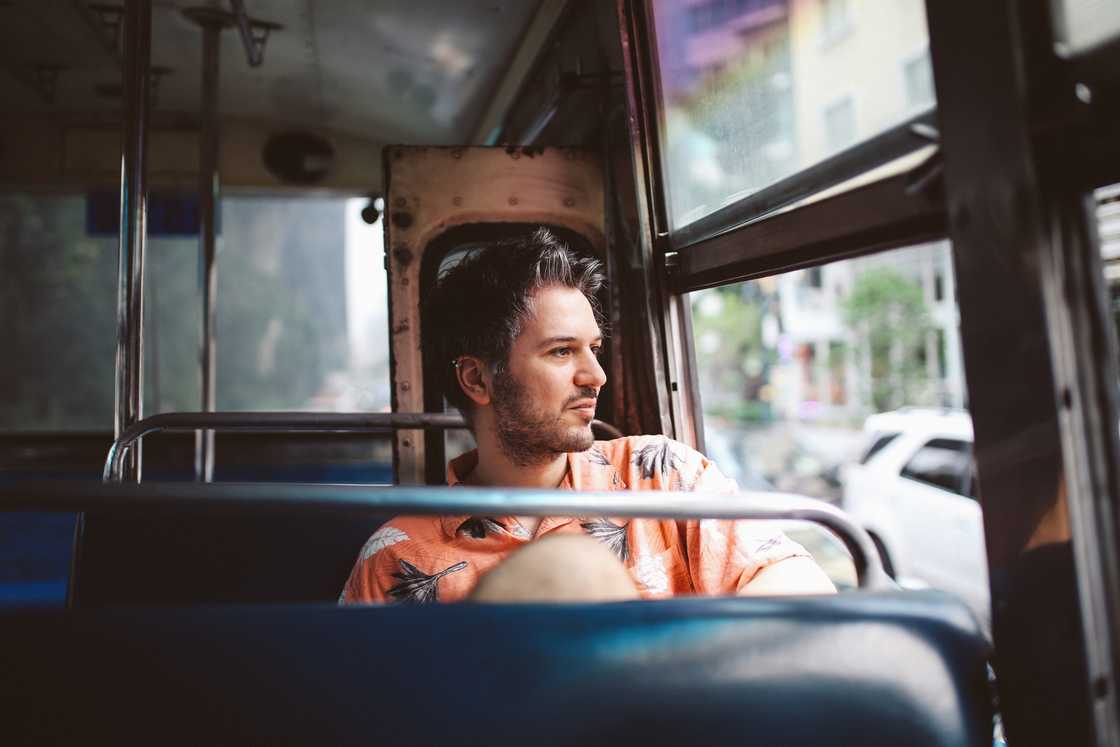 A thoughtful man in a bus